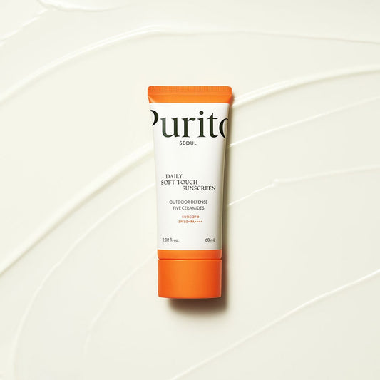 A tube of PURITO SEOUL Daily Soft Touch Sunscreen with SPF50+ PA++++ protection, organic ingredients, and a matte finish.