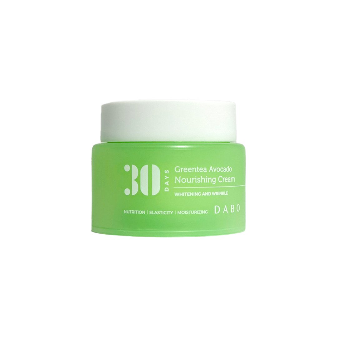 Green jar of Dabo 30 Days Greentea Avocado Nourishing Cream This cream features a lightweight, non-greasy formula that absorbs rapidly, promoting a smooth and healthy appearance.