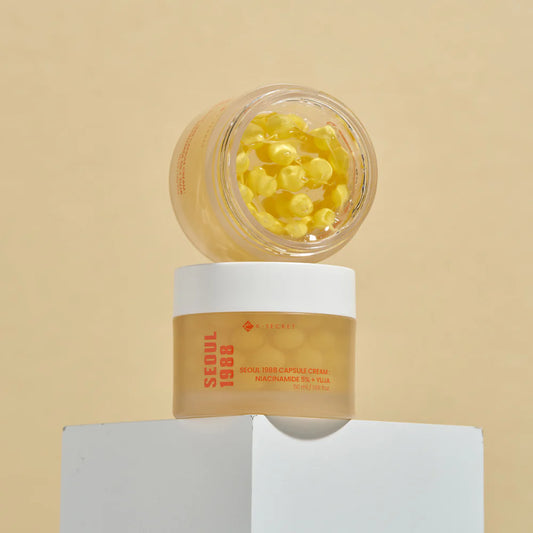 K-SECRET SEOUL 1988 Capsule Cream : Niacinamide 5% + Yuja 50ml  It provides deep hydration through sea buckthorn water and hyaluronic acid, while innovative Vitamin C capsules activate upon application to boost nourishment and radiance, suitable for all skin types.